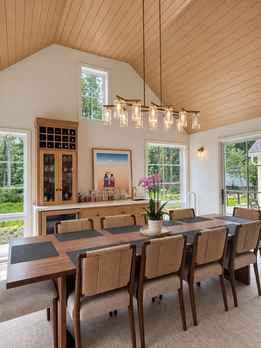 Custom dining room cabinetry beneath a vaulted wood ceiling